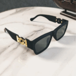 Turn heads with these Unisex Gold Medallion Square Sunglasses